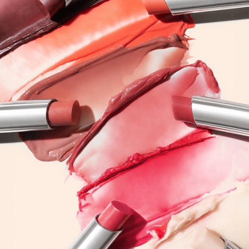 Macro closeup of lip balm shade swatches blended on skin