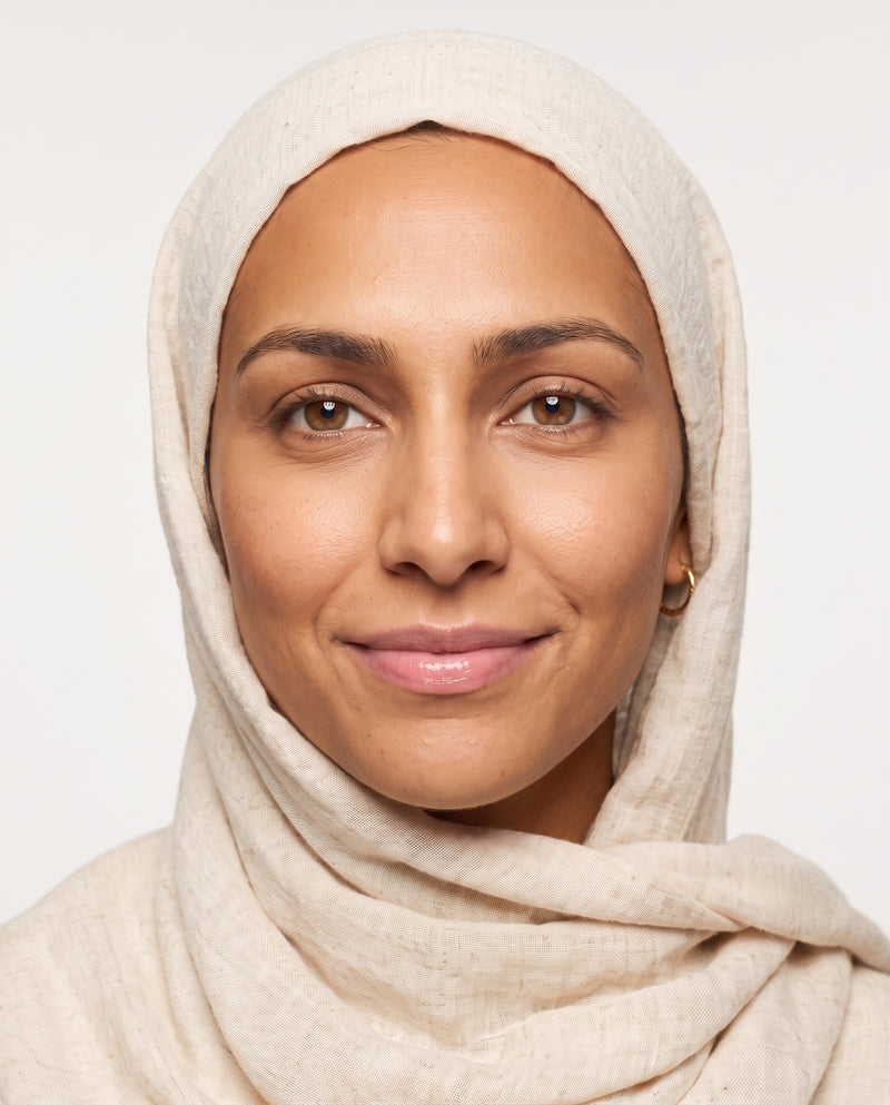 Amira applying Baby Pink tinted lip balm
